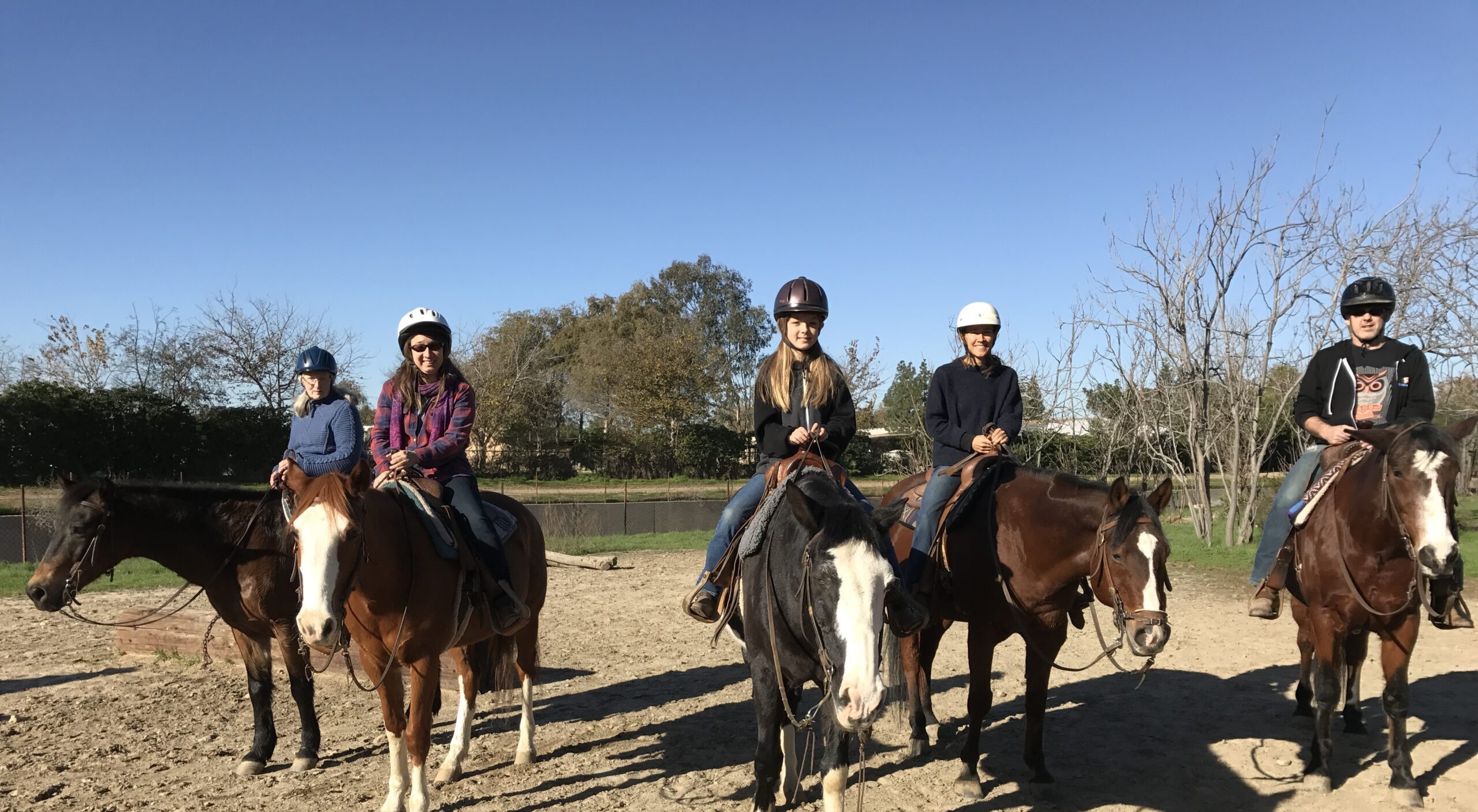 Group of people riding horses